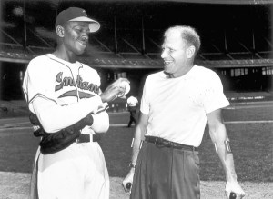 CLEVELAND - 1949. Satchel Paige shows Bill Veeck, owner of the Cleveland Indians, his new fastball grip before a night game at Municipal Stadium in Cleveland in 1949. (Photo by Mark Rucker/Transcendental Graphics, Getty Images) (baseball pro) (Decade 1940s) ** TCN OUT **